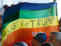 GRAND JUNCTION, CO - OCTOBER 18: Supporters hold up a gay pride flag for Republican presidential candidate Donald Trump on October 18, 2016 in Grand Junction Colorado. Trump is on his way to Las Vegas for the third and final presidential debate against Democratic rival Hillary Clinton. (Photo by George …