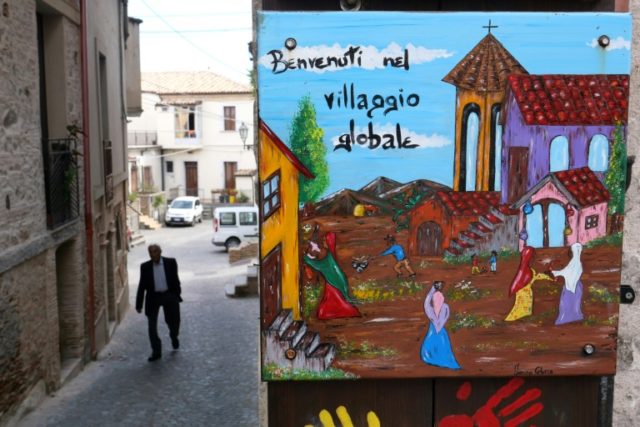 The colourful welcoming signs for refugees are still up, but the town of Riace has swung far-right, against the migrant experiment it once championed How Italy's migrant model town Riace veered far-right