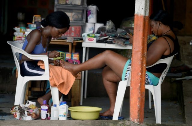 Stuck in southern Mexico, Haitian, African migrants settle in