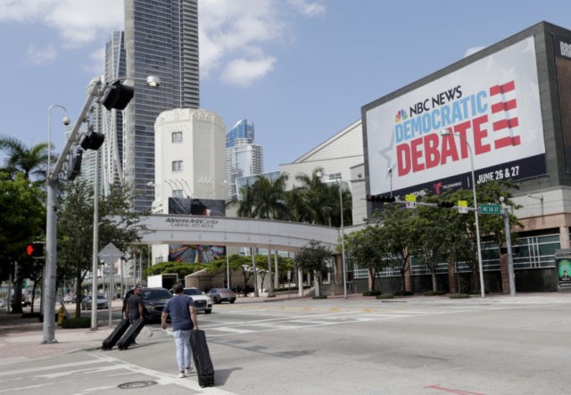 Election 2020 Debate Media In this June 24, 2019, photo, a billboard advertises the Democratic Presidential Debates across from the Knight Concert Hall at the Adrienne Arsht Center for the Performing Arts of Miami Dade County, in Miami. Don't envy NBC News executive Rashida Jones, who is behind this week's inaugural Democratic presidential debate and will have to juggle 20 candidates, five news personalities and, it's likely, one tweeting president.. (AP Photo/Lynne Sladky) The Associated Press