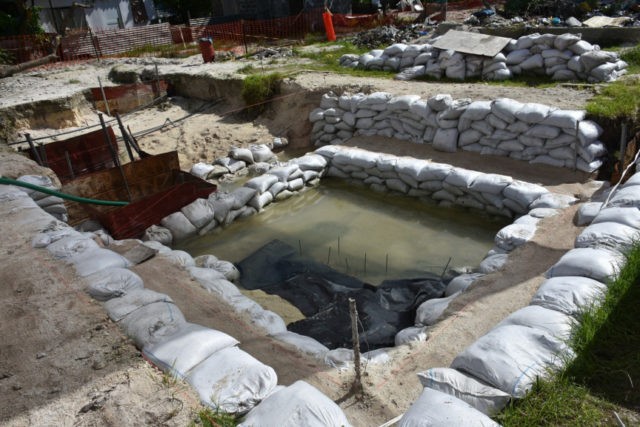 WWII Pacific Remains This June 1, 2019 photo provided by History Flight shows graves of U.S. servicemen under the water table in Tarawa, Kiribati. A nonprofit organization that searches for the remains of U.S. servicemen lost in past conflicts has found what officials believe are the graves of more than 30 Marines and sailors killed in one of the bloodiest battles of World War II. (Eric Albertson/Defense POW/MIA Accounting Agency/History Flight via AP) The Associated Press