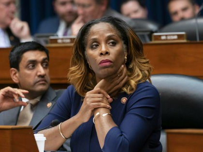 Del. Stacey Plaskett, D-Virgin Islands, joined at left by Rep. Ro Khanna, D-Calif., listen during the roll call as the House Oversight and Reform Committee votes 24-15 to hold Attorney General William Barr and Commerce Secretary Wilbur Ross in contempt for failing to turn over subpoenaed documents related to the …