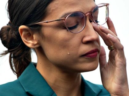 Representative Alexandria Ocasio-Cortez sheds a tear during a February 7 press conference calling on Congress to cut funding for U.S. Immigration and Customs Enforcement and defund border detention facilities. SAUL LOEB/AFP/GETTY IMAGES