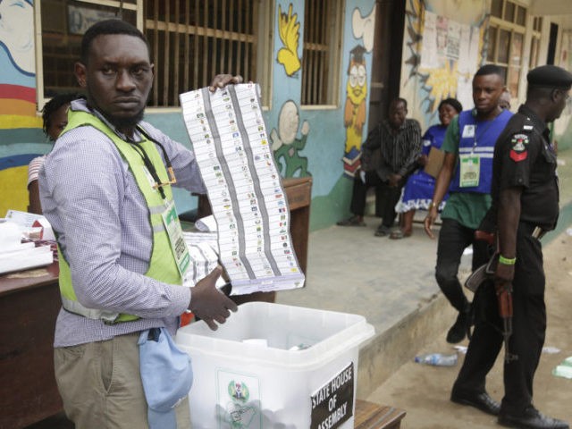 An electoral commission official count ballots papers after the gubernatorial election in