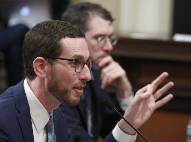 State Sen. Scott Wiener, D-San Francisco, left, discusses his housing measure during a committee hearing Wednesday, April 24, 2019, in Sacramento, Calif. Wiener's bill, SB50, that would increase housing near transportation and job hubs was approved by the Senate Governance and Finance Committee, after it was merged with SB4, a …