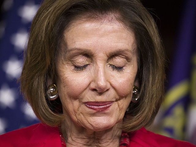 House Speaker Nancy Pelosi of Calif., pauses while speaking when asked about the recent ph