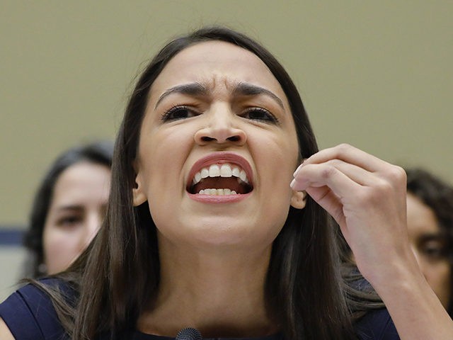 Rep. Alexandria Ocasio-Cortez, D-NY., gestures while testifying before the House Oversight Committee hearing on family separation and detention centers, Friday, July 12, 2019 on Capitol Hill in Washington. (AP Photo/Pablo Martinez Monsivais)
