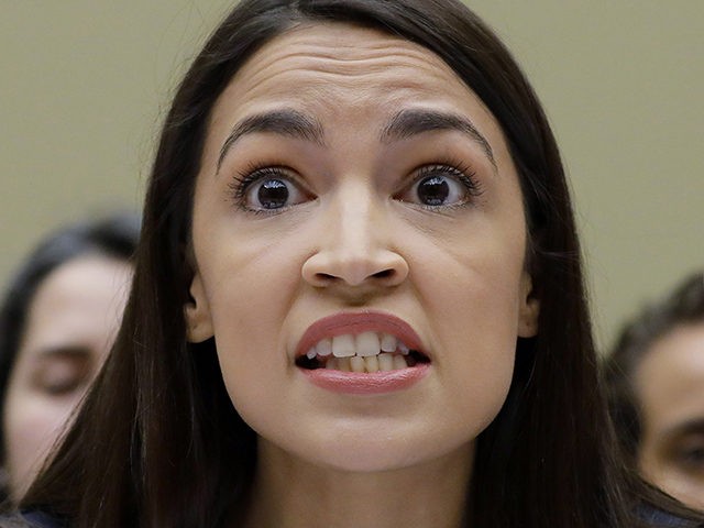 FILE - In this Friday, July 12, 2019, file photo, Rep. Alexandria Ocasio-Cortez, D-NY., gestures while testifying before the House Oversight Committee hearing on family separation and detention centers, on Capitol Hill in Washington. In tweets Sunday, President Donald Trump portrays the lawmakers as foreign-born troublemakers who should go back …