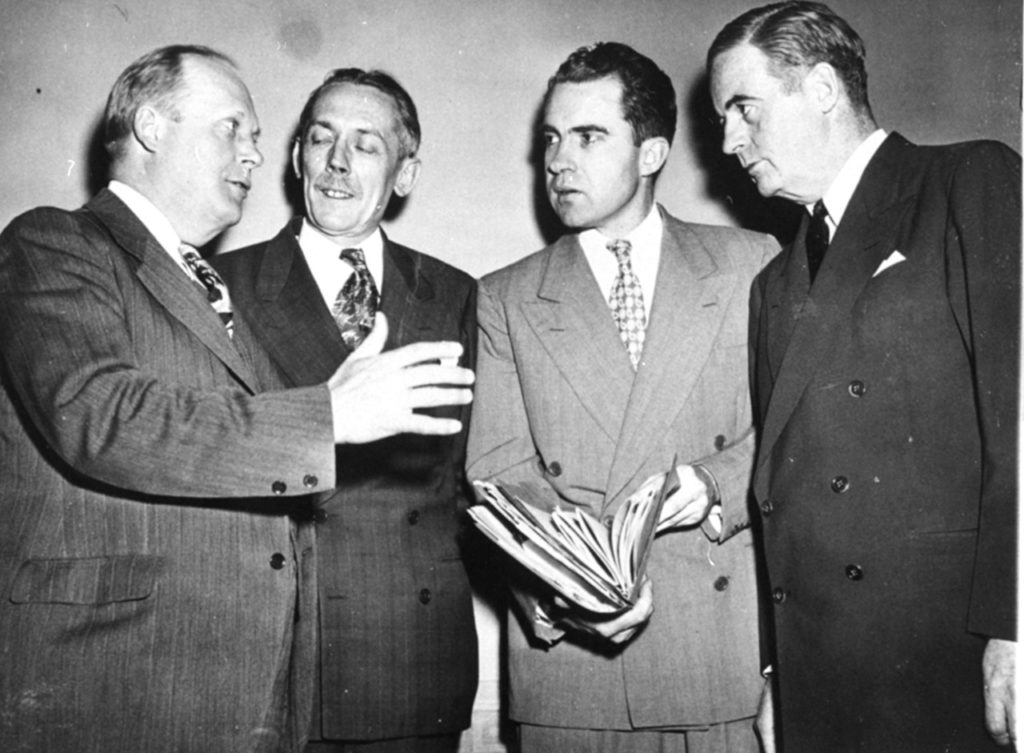 Reps. Karl Mundt, R-SD, John McDowell, R-PA, Richard Nixon, R-CA, and Richard Vail, R-IL, left to right, in Washington, D.C., May 19, 1948, discuss House passage of the Mundt-Nixon anti-Communism bill. The roll call vote was 319 to 58, sending the message to the Senate. Reps. Mundt and Nixon sponsored the bill. (AP Photo)