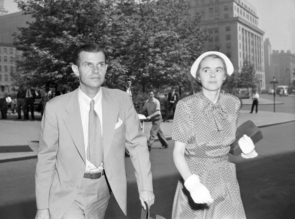 Alger Hiss, former state department employee, arrives at Federal Courthouse in New York City on June 24, 1949 for the second day on the stand testifying in his own behalf in his perjury trial. Hiss on June 24 denied he had seen Whittaker Chambers, the government?s key witness, since late May or early June 1936. He is accompanied by Mrs. Hiss. (AP Photo/ Murray Becker)