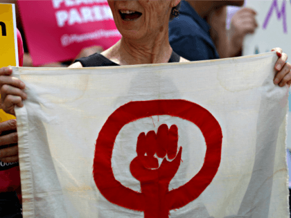 Abortion-rights supporters take part in a protest Thursday, May 30, 2019, in St. Louis. A St. Louis judge heard an hour of arguments Thursday on Planned Parenthood's request for a temporary restraining order that would prohibit the state from allowing the license for Missouri's only abortion clinic to lapse at …