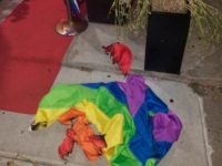 A burned rainbow flag lays on the stoop of the Alibi Lounge, early Monday, July 8, 2019, in New York City, New York. The owner of a New York City gay bar says a rainbow flag was set aflame at the club’s entrance for the second time in just over …