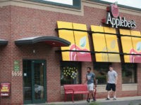 An Applebee's restaurant serves customers on August 10, 2017 in Chicago, Illinois. DineEquity, the parent company of Applebee's and IHOP, plans to close up to 160 restaurants in the first quarter of 2018. The announcement helped the stock climb more than 4 percent today. (Photo by Scott Olson/Getty Images)