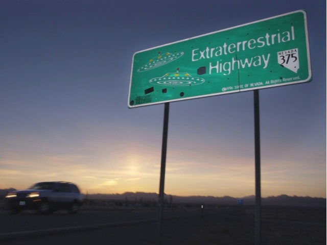 FILE - In this April 10, 2002, file photo, a car moves along the Extraterrestrial Highway