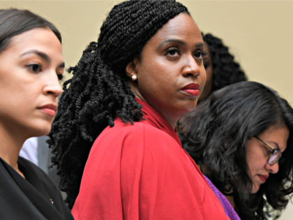 Rep. Alexandria Ocasio-Cortez, D-N.Y., left, Rep. Ayanna Pressley, D-Mass., center, and Re