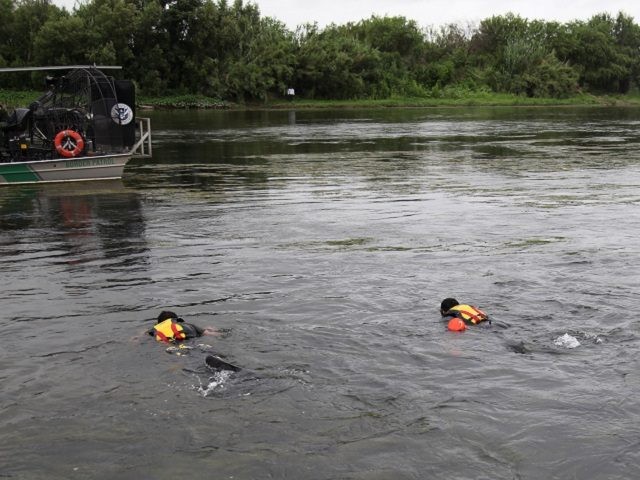 Del Rio Sector BORSTAR agent dive team searches for missing Haitian/Brazilian migrant todd
