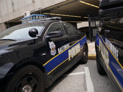Police cars are seen outside of the Baltimore City Police Headquarters in Baltimore on Aug