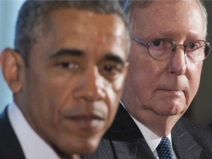 US President Barack Obama speaks alongside Senate Majority Leader Mitch McConnell (R), Republican of Kentucky, prior to a meeting of the bipartisan, bicameral leadership of Congress in the Cabinet Room at the White House in Washington, DC, January 13, 2015. AFP PHOTO / SAUL LOEB (Photo credit should read SAUL …
