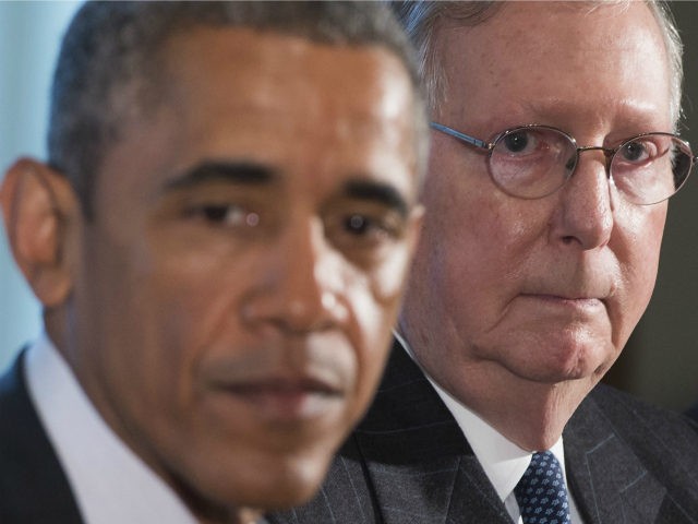 US President Barack Obama speaks alongside Senate Majority Leader Mitch McConnell (R), Rep