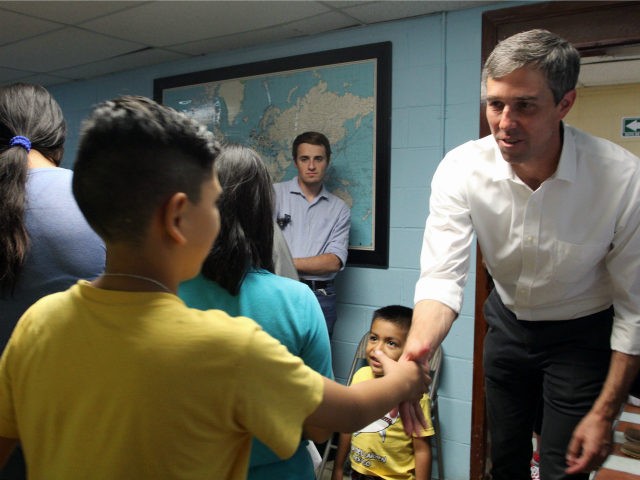 Mexican former congressman and presidential candidate hopeful for the Democratic Party, Beto O'Rourke (R), shakes hands with a Central American migrant child during a visit at the "House of the migrant" shelter in Ciudad Juarez, Chihuahua State, Mexico on June 30, 2019. (Photo by HERIKA MARTINEZ / AFP) (Photo credit …