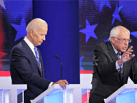 MIAMI, FLORIDA - JUNE 27: Democratic presidential candidate former Vice President Joe Biden looks on as Sen. Bernie Sanders (I-VT) speaks during the second night of the first Democratic presidential debate on June 27, 2019 in Miami, Florida. A field of 20 Democratic presidential candidates was split into two groups …
