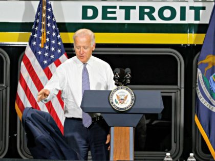 Vice President Joe Biden throws his coat down before speaking in Detroit, Thursday, Sept. 17, 2015. Biden spoke on how federal investments are helping Detroit’s economic revitalization efforts. (AP Photo/Paul Sancya)