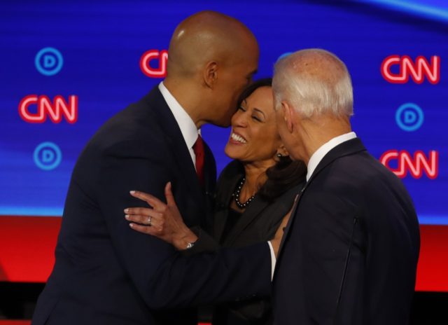 Sen. Cory Booker, D-N.J., former Vice President Joe Biden and Sen. Kamala Harris, D-Calif., talk after the second of two Democratic presidential primary debates hosted by CNN Wednesday, July 31, 2019, in the Fox Theatre in Detroit. (AP Photo/Paul Sancya)