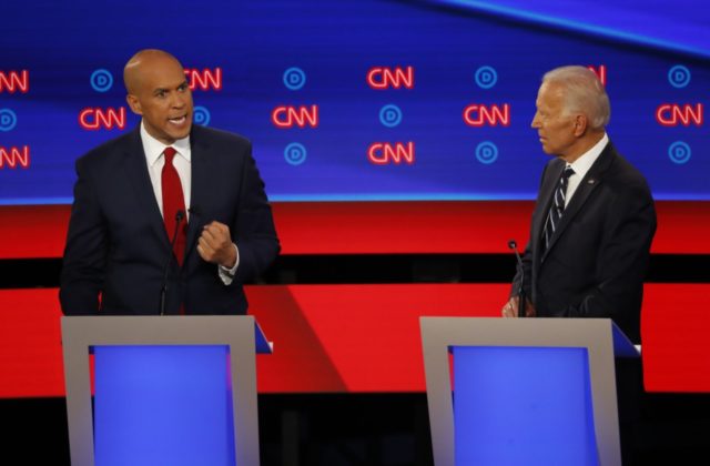 Sen. Cory Booker, D-N.J., speaks as former Vice President Joe Biden listens during the second of two Democratic presidential primary debates hosted by CNN Wednesday, July 31, 2019, in the Fox Theatre in Detroit. (AP Photo/Paul Sancya)