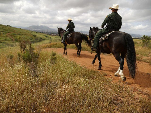 Border Patrol agents on horseback