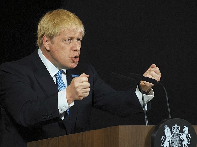 Britain's Prime Minister Boris Johnson gestures as he gives a speech on domestic prioritie