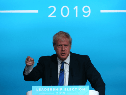 Conservative MP and leadership contender Boris Johnson gestures as he takes part in a Conservative Party Hustings event in Cardiff, south Wales, on July 6, 2019. - Britain's leadership contest is taking the two contenders on a month-long nationwide tour where they will each attempt to reach out to grassroots …