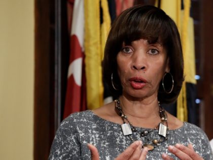 In this Tuesday, April 4, 2017 file photo, Baltimore Mayor Catherine Pugh, left, speaks alongside Baltimore Police Department Commissioner Kevin Davis at a news conference at City Hall in Baltimore, in response to the Department of Justice's request for a 90-day delay of a hearing on its proposed overhaul of …
