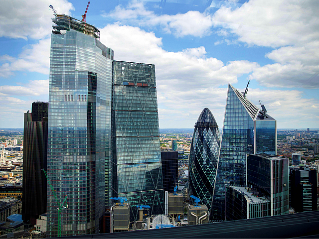 Skyscraper office blocks, including Tower 42 (L), the Leadenhall Building, commonly called the "Cheesegrater" (C), 30 St Mary Axe commonly called the "Gherkin" (centre R), and 5254 Lime Street, commonly called the "Scalpel" (R) are pictured from inside the Sky Garden in London on July 3, 2019. (Photo by Tolga …