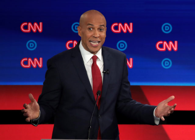 DETROIT, MICHIGAN - JULY 31: Democratic presidential candidate Sen. Cory Booker (D-NJ) speaks during the Democratic Presidential Debate at the Fox Theatre July 31, 2019 in Detroit, Michigan. 20 Democratic presidential candidates were split into two groups of 10 to take part in the debate sponsored by CNN held over …