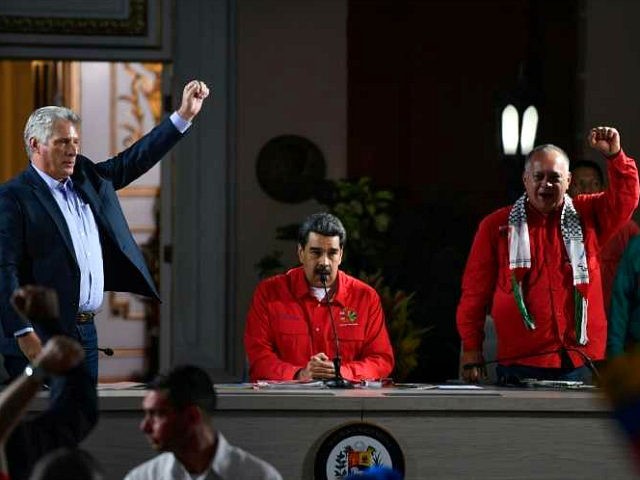 (L-R) Cuban President Miguel Diaz-Canel, his Venezuelan counterpart Nicolas Maduro and the president of the Venezuelan National Constituent Assembly Diosdado Cabello are pictured during the closing ceremony of the the Sao Paulo Forum at Miraflores Presidential Palace in Caracas on July 28, 2019. - Sao Paulo Forum is a conference …