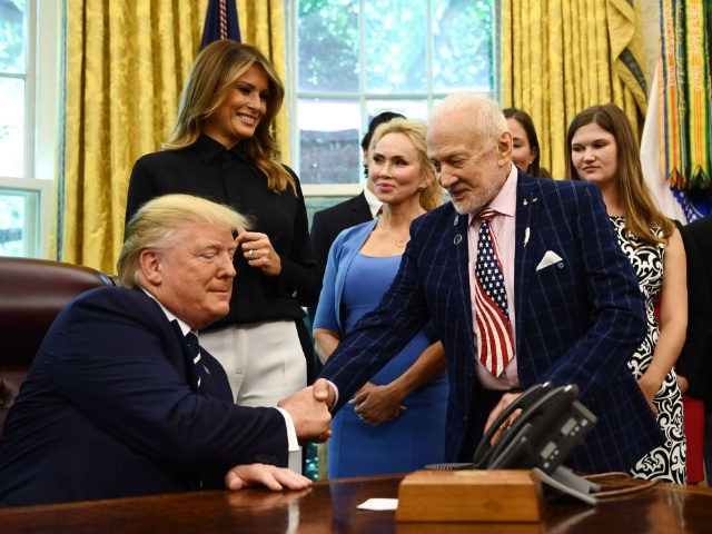 US President Donald Trump shakes hands with Apollo 11 crew member Buzz Aldrin on July 19, 2019, at the White House in Washington, DC, during a ceremony commemorating the 50th anniversary of the Moon landing. (Photo by Brendan Smialowski / AFP) (Photo credit should read BRENDAN SMIALOWSKI/AFP/Getty Images)