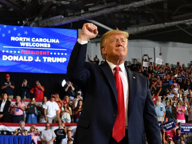 US President Donald Trump pumps his fist as he arrives at a "Make America Great Again" rally at Minges Coliseum in Greenville, North Carolina, on July 17, 2019. (Photo by Nicholas Kamm / AFP) (Photo credit should read NICHOLAS KAMM/AFP/Getty Images)