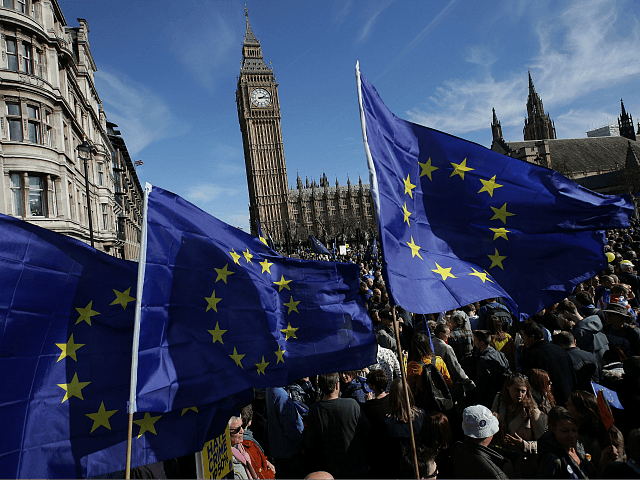 Demonstrators holding EU flags gather in Parliament Square following an anti Brexit, pro-E