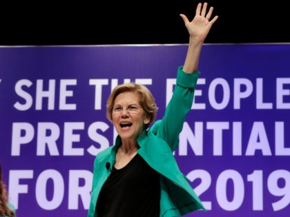 Democratic presidential candidate Sen. Elizabeth Warren, D-Mass., waves to the audience before taking questions during a presidential forum held by She The People on the Texas State University campus Wednesday, April 24, 2019, in Houston. (AP Photo/Michael Wyke)