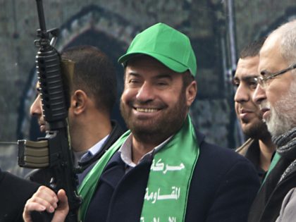 Hamas leaders Fathi Hammad (2R) and Mahmoud al-Zahar (2L) take part in a rally marking the