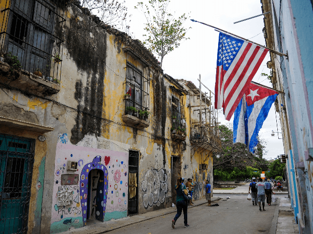 Cuban and US flags are pictured in a street of Havana, on September 20, 2018. - The Cuban