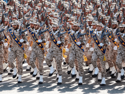Members of Iran's Revolutionary Guards Corps (IRGC) march during the annual military parade marking the anniversary of the outbreak of the devastating 1980-1988 war with Saddam Hussein's Iraq, in the capital Tehran on September 22, 2018. - In Iran's southwestern city of Ahvaz during commemoration of the same event, dozens …