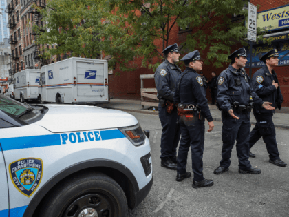 Law enforcement officials respond to a suspicious package at a U.S. Post Office facility at 52nd Street and 8th Avenue in Manhattan, October 26, 2018 in New York City. The latest package bomb device intercepted in New York City this morning was addressed to former Director of National Intelligence James …