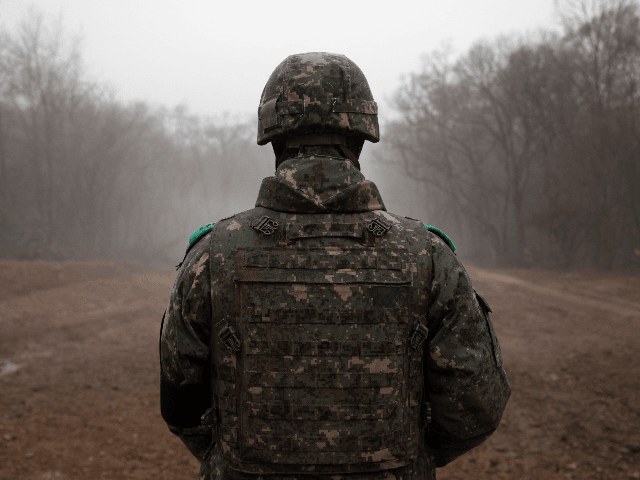 In a photo taken on December 3, 2018 a South Korean soldier stands before the Military Dem