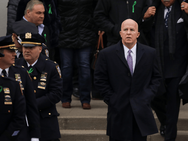 New York City Police Commissioner James P. O'Neill exits the church following the funeral