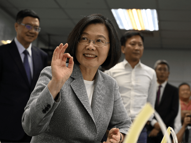 Taiwan's President Tsai Ing-wen gestures while registering as the ruling Democratic Progre