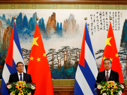 Chinese Foreign Minister Wang Yi (R) and Cuban Foreign Minister Bruno Rodriguez attend a n