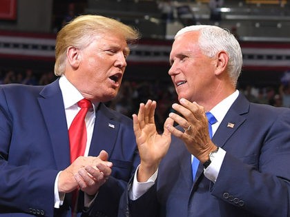US Vice President Mike Pence speaks with US President Donald Trump at a rally to officially launch the Trump 2020 campaign, at the Amway Center in Orlando, Florida on June 18, 2019. - Trump kicks off his reelection campaign at what promised to be a rollicking evening rally in Orlando. …