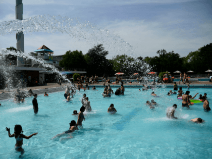 Visitors swim in a swimming pool in Essen, western Germany, on June 25, 2019, as temperatures topped 36 degrees Celsius. - Europeans are set to bake in what forecasters are warning will likely be record-breaking temperatures for June with the mercury set to hit 40 degrees Celsius (104 degrees Fahrenheit) …