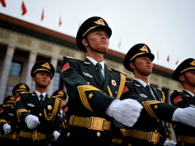 Chinese honour guards prepare for the arrival of Turkish President Recep Tayyip Erdogan an